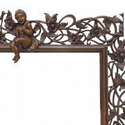 Vicente Andreu. A fretworked wooden frame with cherubs, 20th century - 2