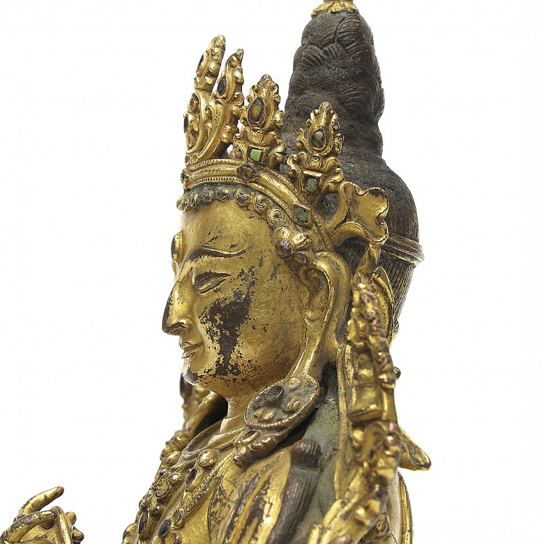 A gilt-bronze figure of 