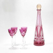 Set of decanter and four red glass goblets, Baccarat.
