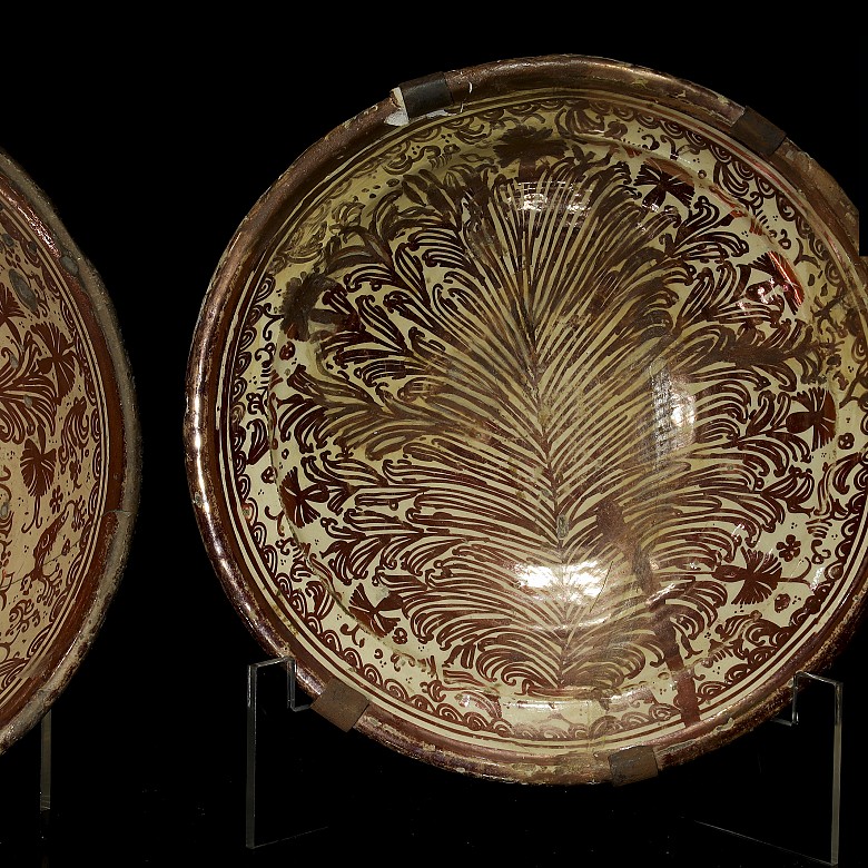 Two deep plates and a bowl in metallic lustre 