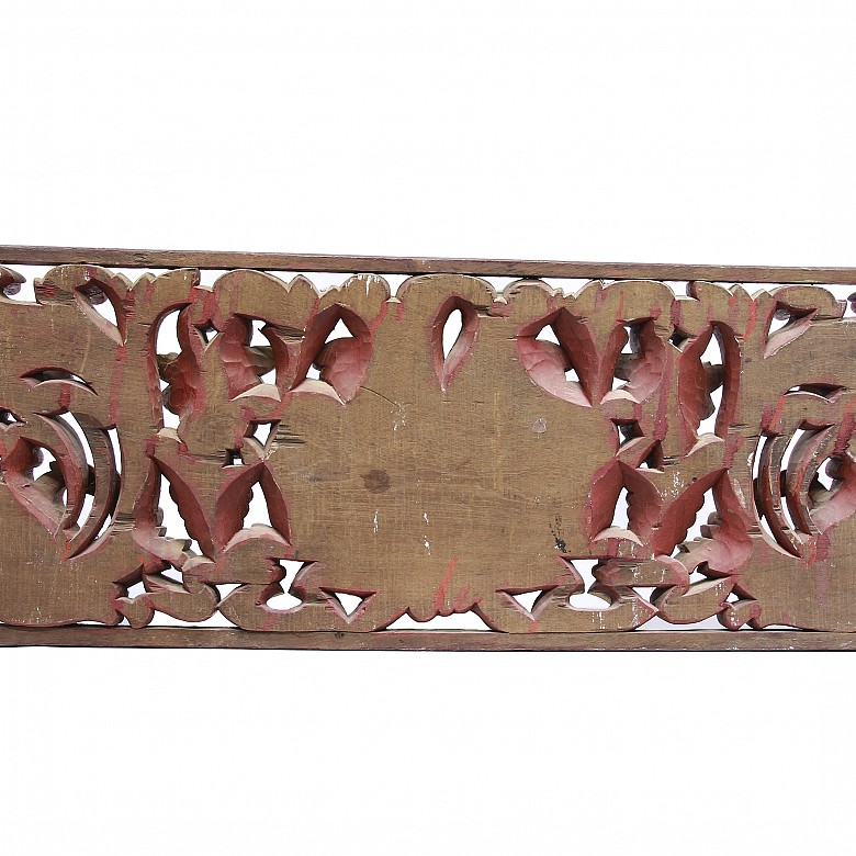 Large carved wooden lintel with horns of plenty, Bali, Indonesia.