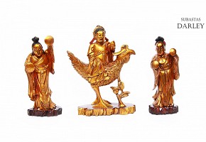 Three sculptures in gilded wood, represent deities, 20th century