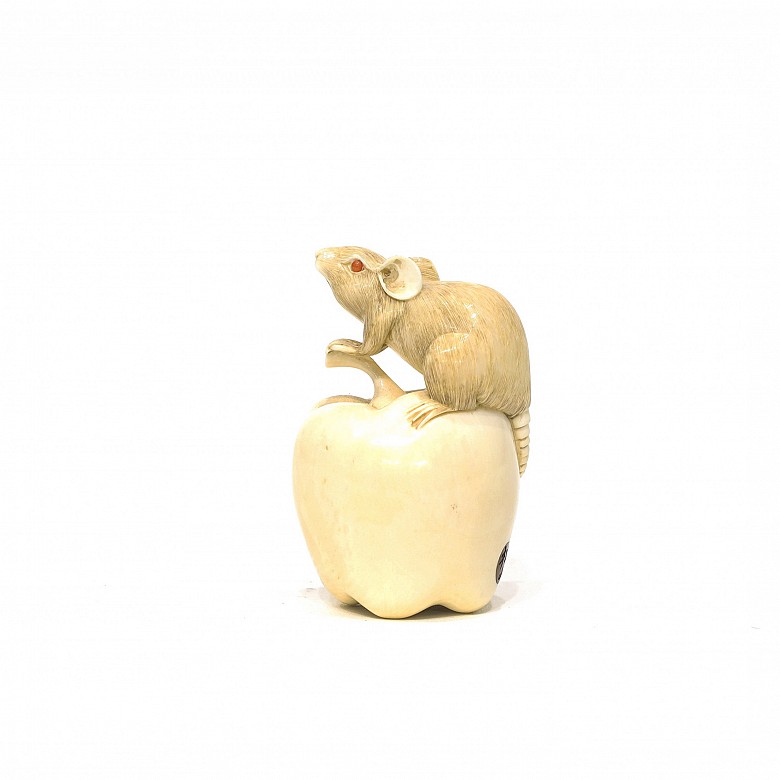 Rat and apple carved in mammoth bone.