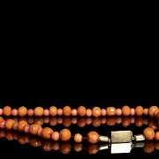 A carved beads necklace.