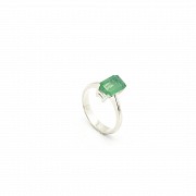 Emerald solitaire in 18k white gold.