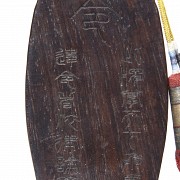 Carved wooden plaque, 20th century