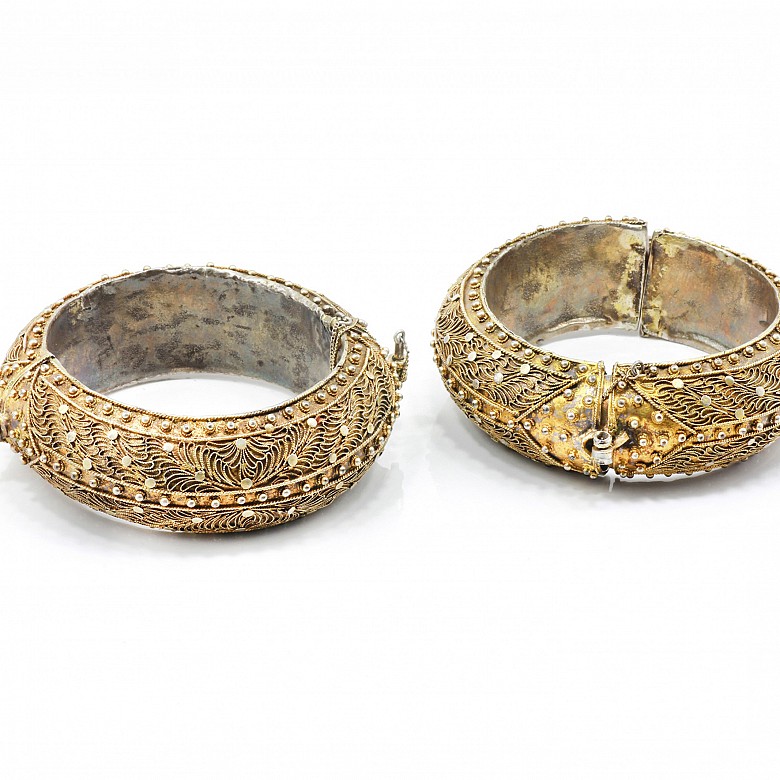 Pair of silver gilt bracelets with filigree.