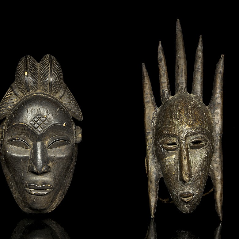 Two carved wooden African ceremonial masks, 20th century