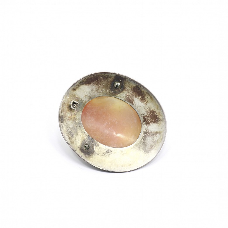 Silver cameo with agate center.