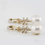 Pearl earrings in 18k yellow gold and diamonds. - 2