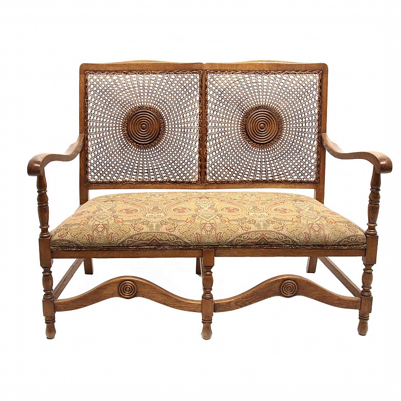 Canapé of walnut and grid backrest with rosette, 20th century