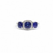 18k white gold ring with sapphires and diamonds.