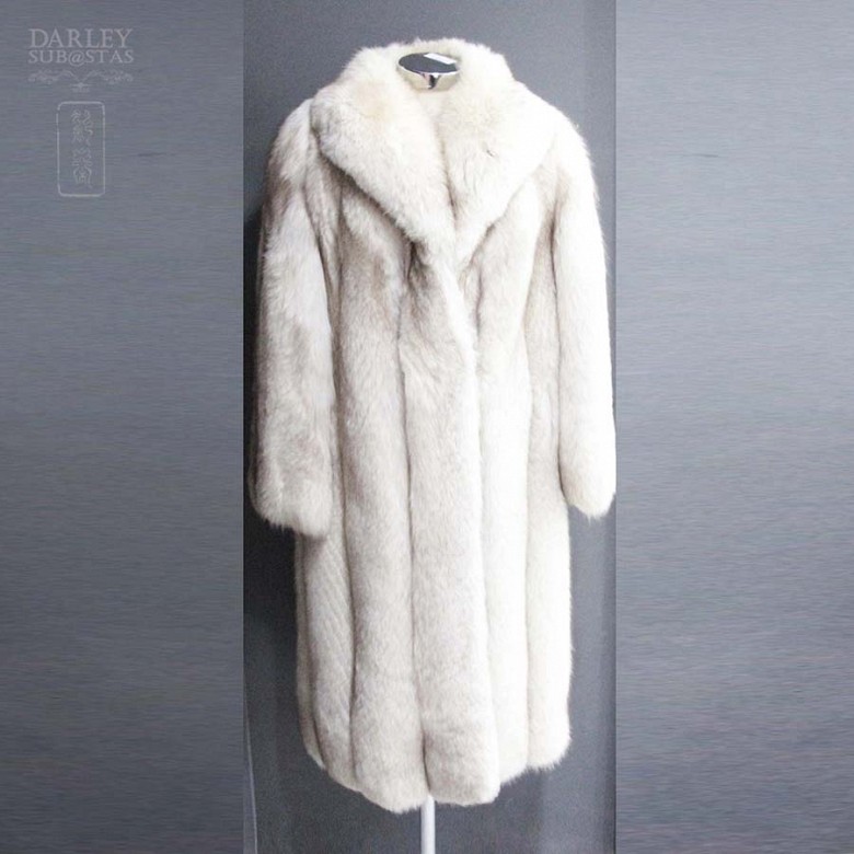 Long white fox fur coat.