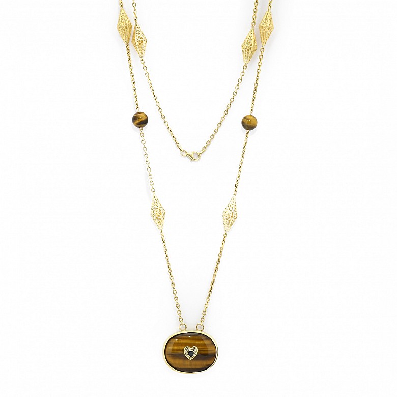 18 kt yellow gold necklace with a tiger eye, diamond and sapphire pendant