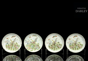 Set of four enamelled plates, 20th century