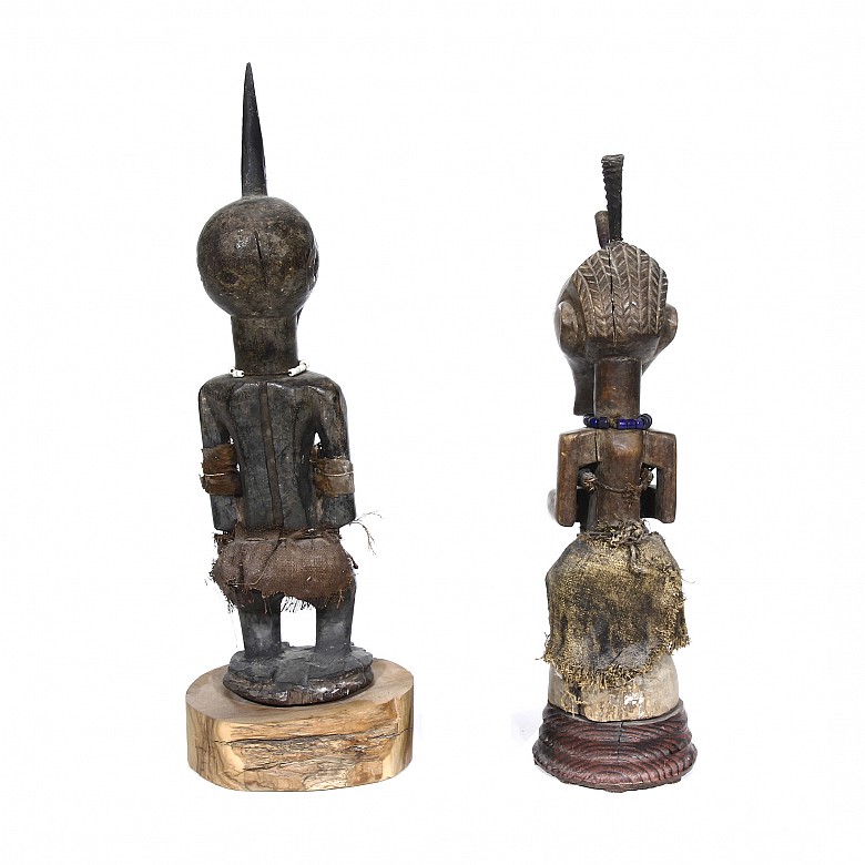 Two sculptures of African warriors.