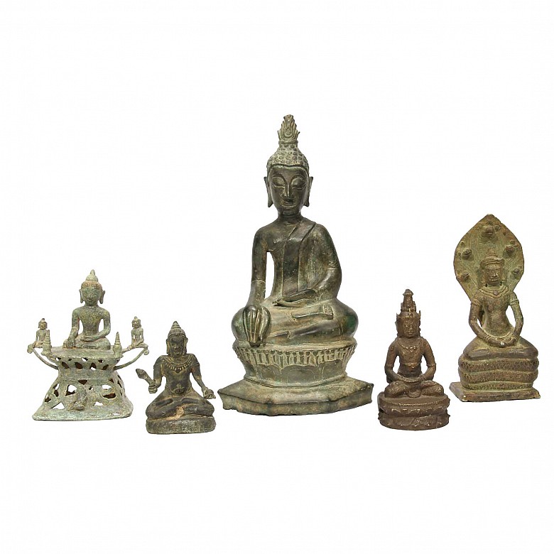 Five bronze Buddha sculptures.
