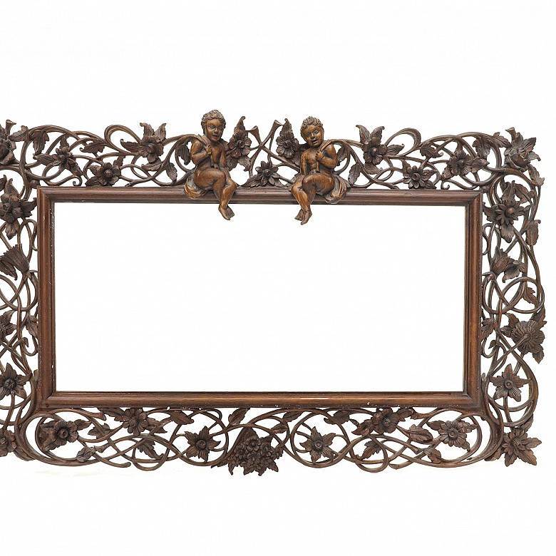 Vicente Andreu. A fretworked wooden frame with cherubs, 20th century