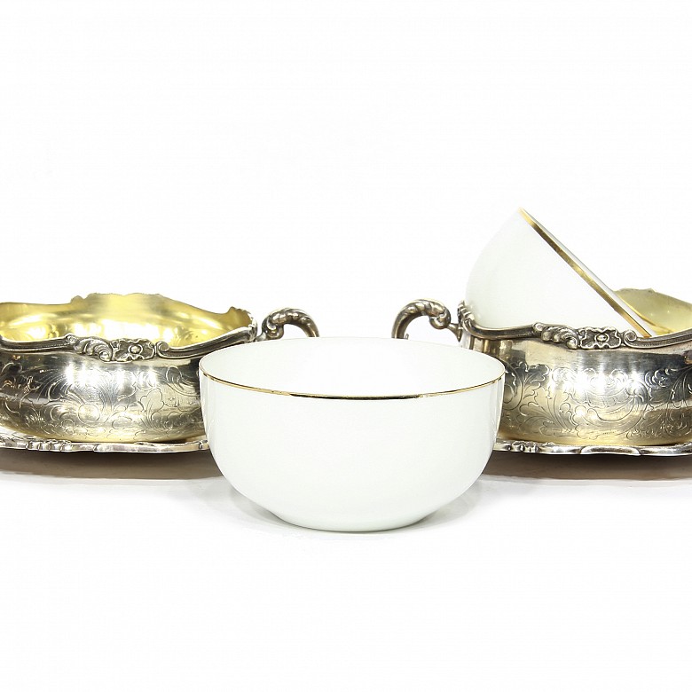 Pair of silver cups with porcelain bowl.