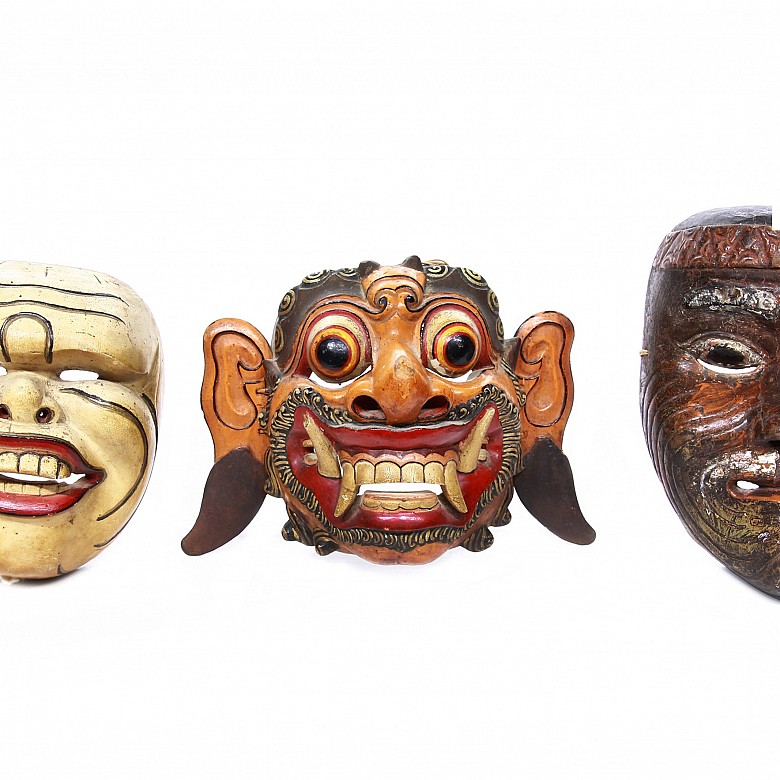 Three carved wooden topeng masks, 20th century