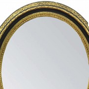 Mirror with motifs in relief, early 20th century