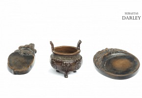 Two palettes and an earthenware censer, 20th century