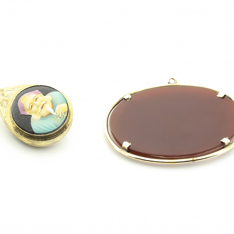 Two pendants with 18k gold setting