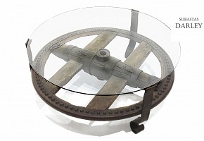 Table with antique wagon wheel.