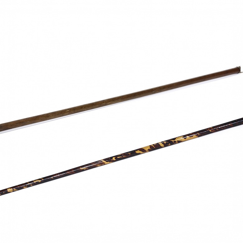 Two canes with damascened iron handle, 20th century