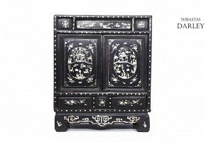 A Chinese lacquered cabinet with mother-of-pearl inlays, Qing dynasty.