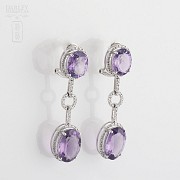 Long earrings with amethysts and diamonds.