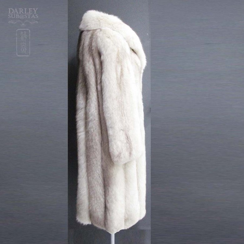 Long white fox fur coat.