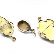 Two brooches and a pendant in a modernist style.