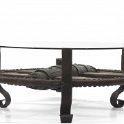Table with antique wagon wheel.