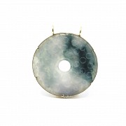 Carved jade medallion with 14k yellow gold setting
