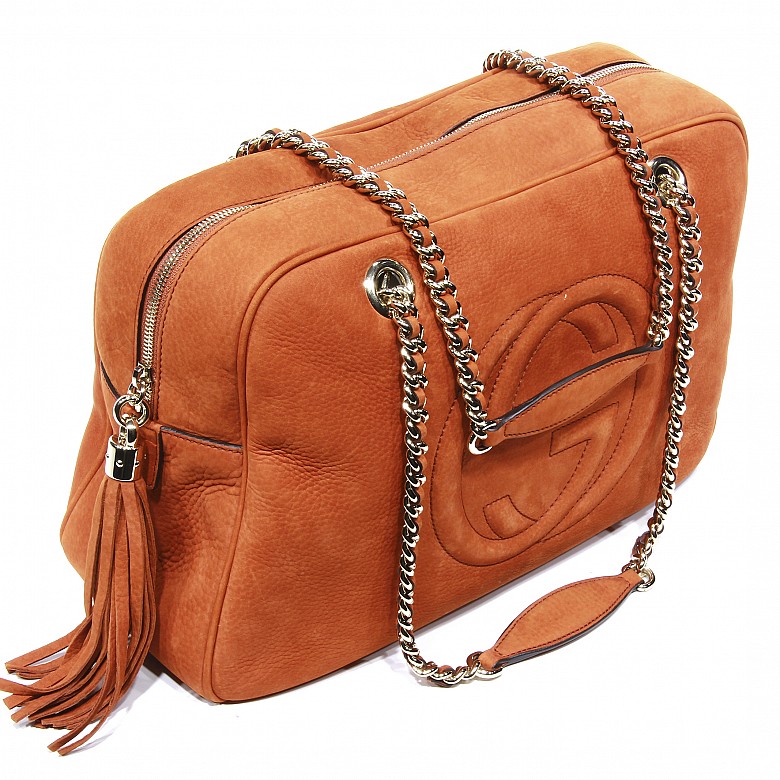 Gucci women's orange leather bag.