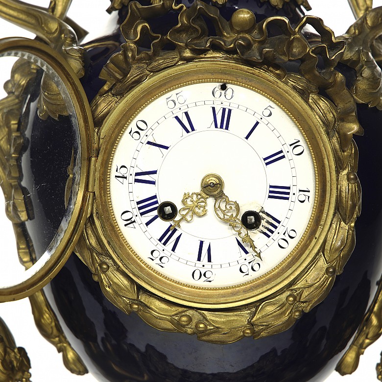 Louis XVI style table clock with five-light chandeliers, 19th century
