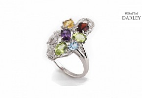 18k gold ring with five color gems and diamonds.