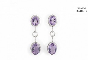 Long earrings with amethysts and diamonds.