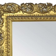 Wooden mirror with carved and gilded frame, 20th c.