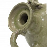 Yue style ceramic jug glazed in green.