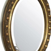 Carved and gilded wooden mirror, 20th century