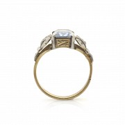 18k Gold ring with diamonds and a blue stone
