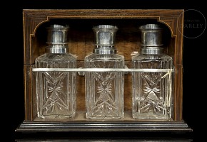 Set of three decanters with wooden box