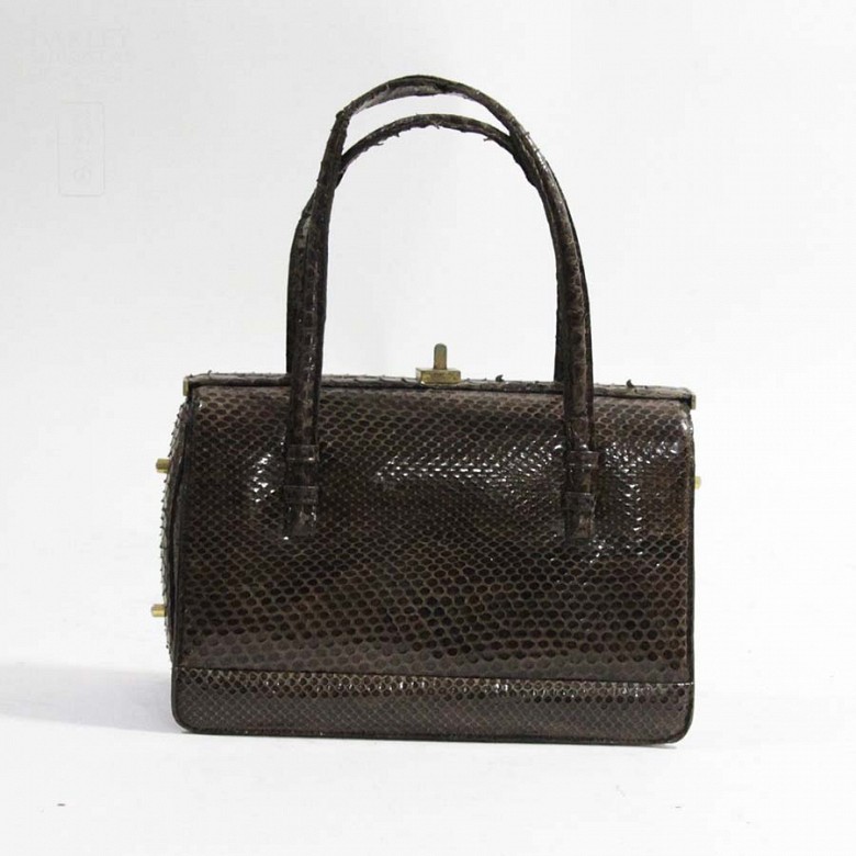 Python leather handbag in brown color.