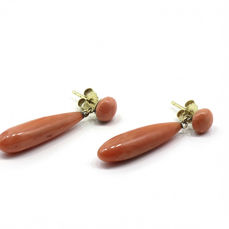Pair of coral earrings set in 14k yellow gold