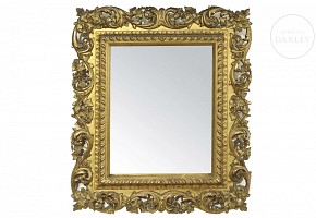 Espejo de madera con marco tallado y dorado, s.XX