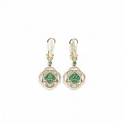 Earrings in 18k yellow gold, emeralds and diamonds.