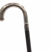 Wooden cane with silver handle and ebony stick