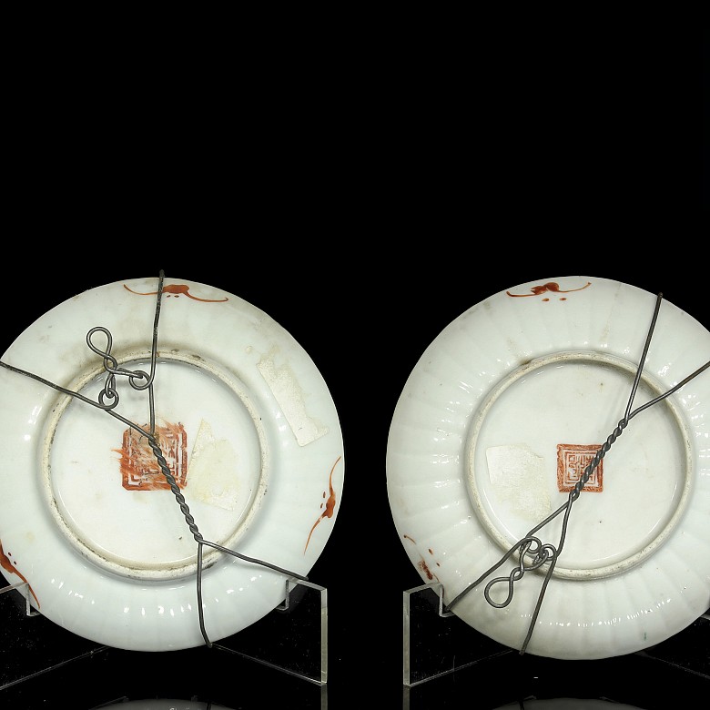 Set of four enamelled plates, 20th century